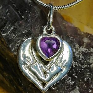 AFRICAN AMETHYST HEART, IN A STERLING SILVER HEART SETTING 18" STERLING CHAIN.